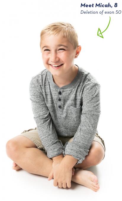EXONDYS 51 patient Micah EXONDYS 51 patient Micah, age 8, sitting cross-legged and barefoot, with a big smile and hands on his ankle