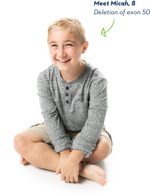 EXONDYS 51 patient Micah EXONDYS 51 patient Micah, age 8, sitting cross-legged and barefoot, with a big smile and hands on his ankle